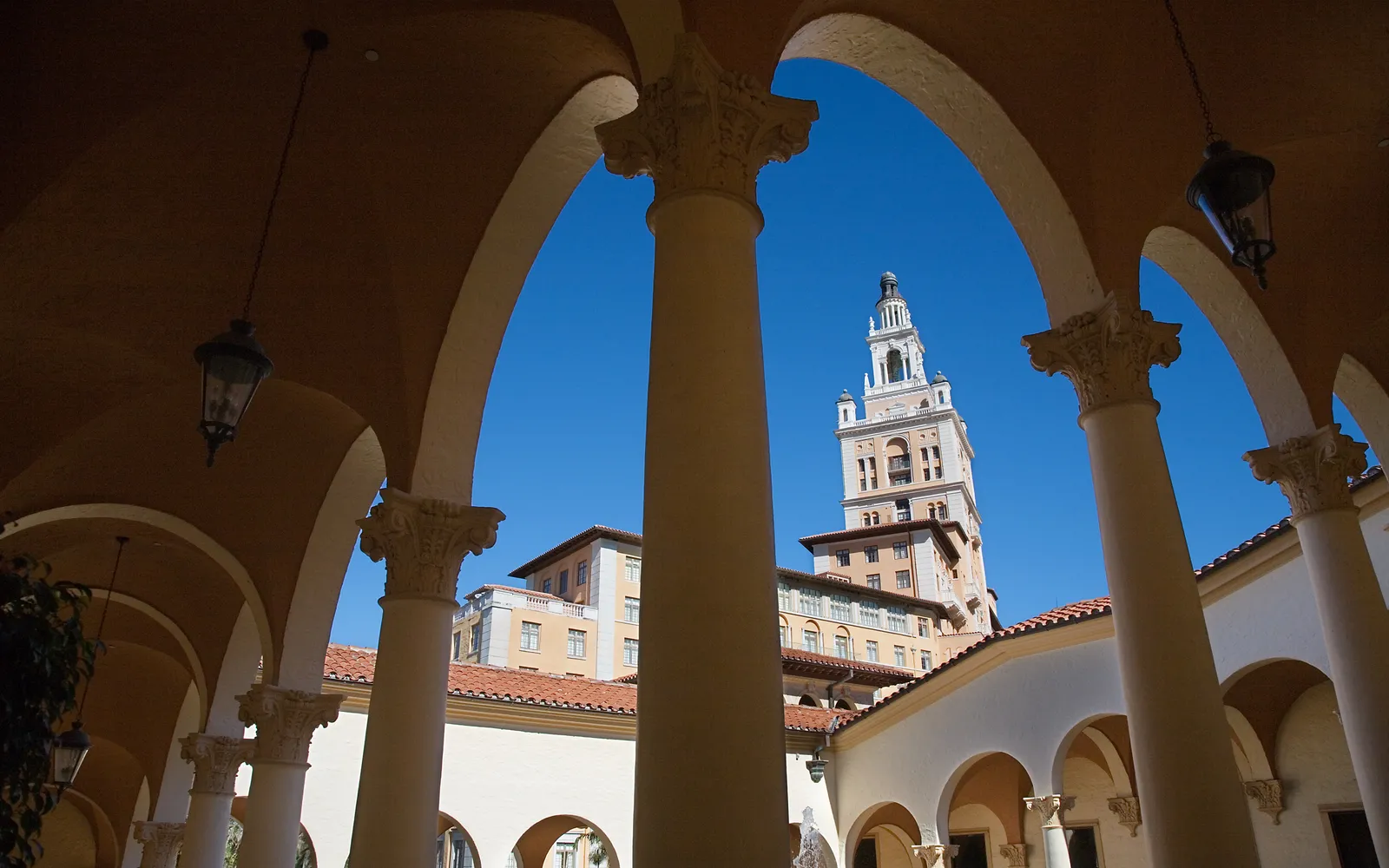 The Biltmore Hotel tower seen through Mediterranean-style arches, Coral Gables, Florida