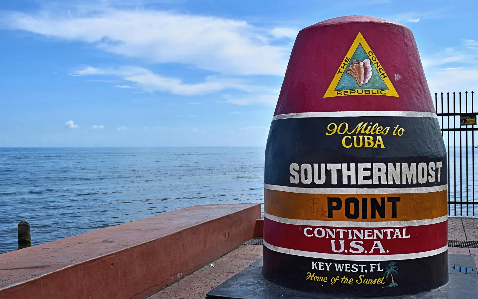 The Southernmost Point buoy by the ocean in Key West, Florida